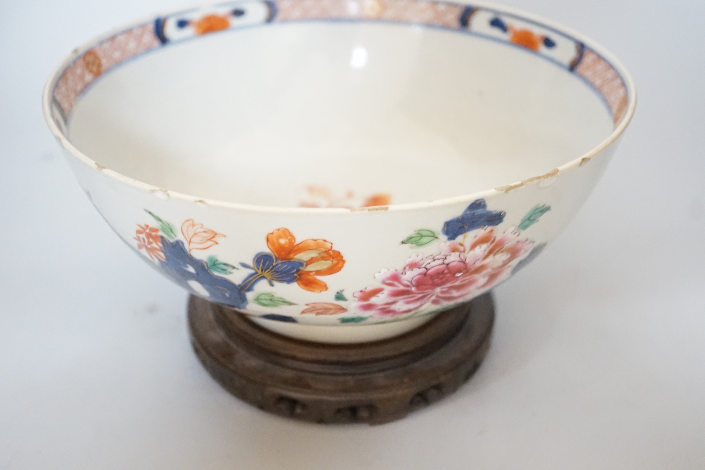 An 18th century Chinese famille rose bowl on wood stand, c.1740, diameter 26cm